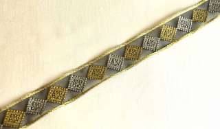 jacquard woven metallic motif of diamonds adorns this organza ribbon