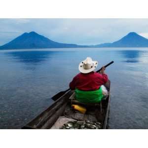  Man on Canoe in Lake Atitlan, Volcanoes of Toliman and San 