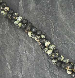 is for one strand of Black Zebra stone beads. The bead strands measure 