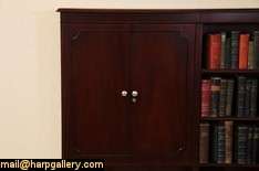 An executive credenza with bookcase or hutch top is signed by premier 