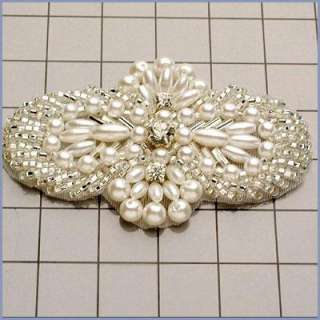   beading and 3 rhinestones. Measures approximately 3In x 1.75In