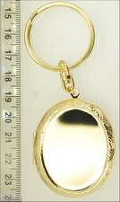 YBM lg. oval engraved locket, eagle eye agate cabochon  