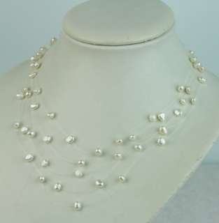 This is a brand new 5 strand freshwater white baroque pearl necklace 